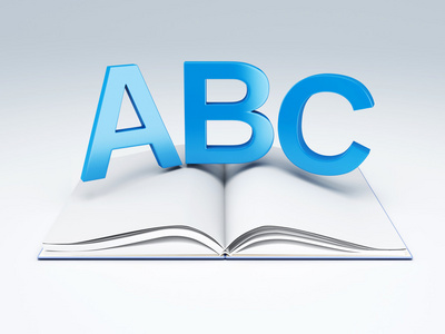 abc 字母与本打开的书。教育理念
