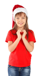 可爱的小孩子在圣帽把手的形状的心脏在白色的背景。圣诞庆典