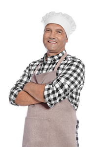 成熟的男性厨师在围裙在白色背景