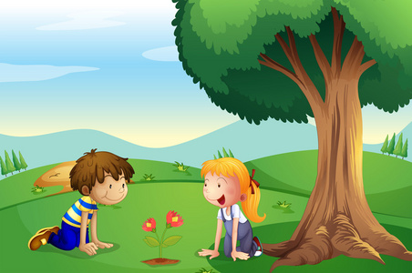 一个女孩和一个男孩看着植物的生长