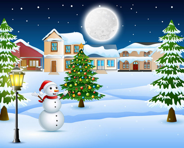 夜冬天村庄风景与雪覆盖的房子, 圣诞树和雪人
