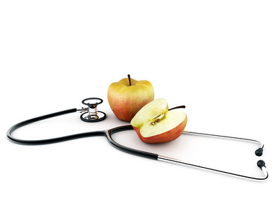 苹果与孤立在白色背景上的听诊器