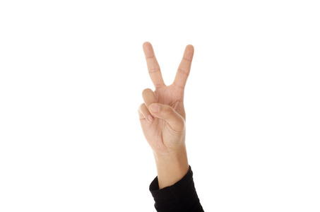 手用两个手指向上在和平或胜利的象征。孤立对白色