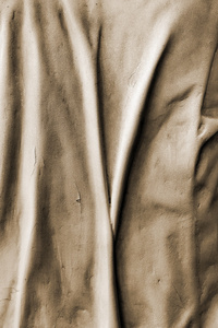 浅浮雕中的褶皱布料织物作为背景的形式
