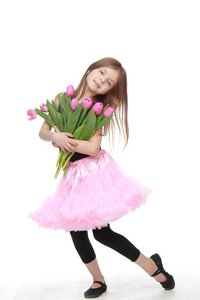 美丽小芭蕾舞女演员在举行一个大花束郁金香的图图