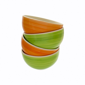 明亮的塔陶瓷碗 绿色和橙色的颜色