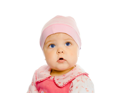 女婴在一条粉红色的裙子和帽子。肖像。工作室。分离