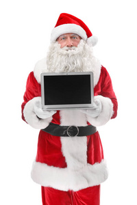 抱着笔记本电脑在白色背景上的圣诞老人