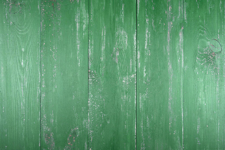 木质纹理背景。旧木质地的表面。木板漆成绿色。板垂直排列