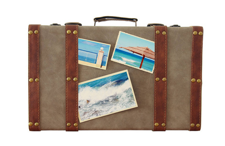 旧古董行李的形象与度假照片的白色隔离