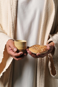 耶稣拿着面包和酒
