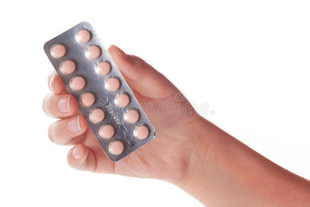 女性手上的药丸容器，隔离
