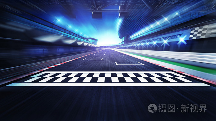 终点线在跑道上与聚光灯在运动模糊