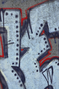墙上的一个片断的纹理与涂鸦绘画, 这是描绘在它。在街头艺术和涂鸦文化话题上画一幅涂鸦图片