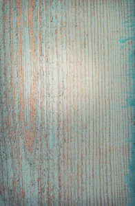 蓝色的油漆剥落的老木表面