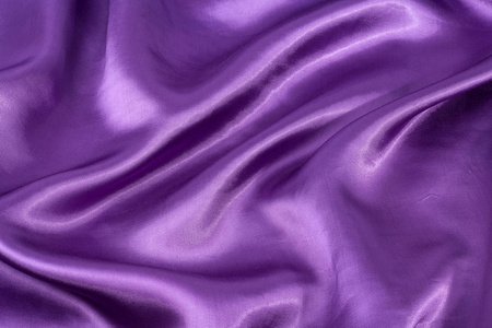 丝绸的背景，纹理的紫罗兰色的闪光布