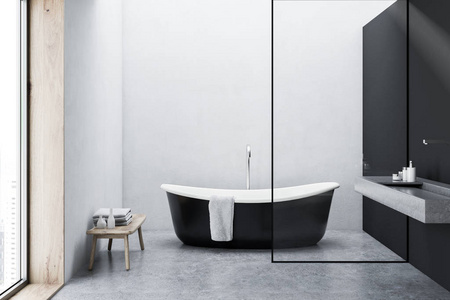 黑色浴缸里挂着一条毛巾, 站在一层简约灰色和白色墙上的浴室的水泥地板上。3d 渲染模拟