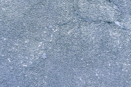 浅蓝色砂纸质地。粗砂磨料的背景。使用的谷物金刚砂背景