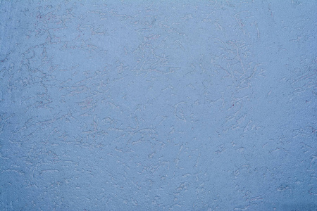 墙面的蓝色纹理覆盖着装饰性石膏的蛀虫型, 特写建筑的抽象背景