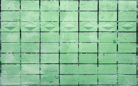 漆成绿色的旧瓷砖墙纹理图片