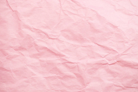 粉红色皱巴巴的纸张纹理背景