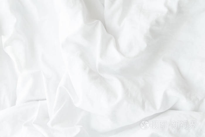 白色床上用品床单或白色织物防皱纹理背景 软焦点照片-正版商用图片0