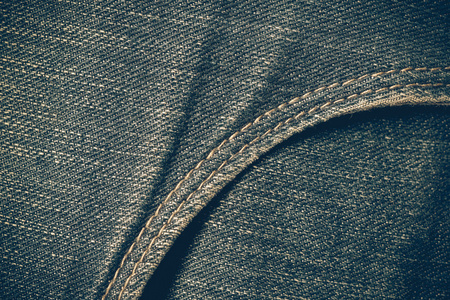 质地的蓝色牛仔裤背景与滤波效果复古 vintag