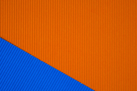蓝色和橙色波纹纸纹理, 用于背景。具有复制空间的生动色彩, 用于添加文本或对象