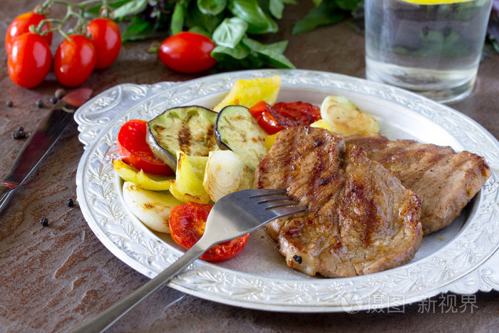 porksteak,streakypork grilled steak meat pork and grilled vegetables on