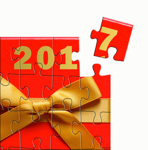 快乐新的一年 2017年设计概念与红色礼品盒益智