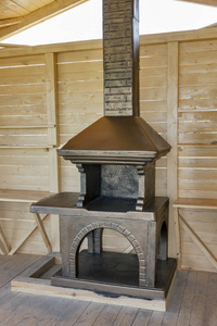新建石烧烤在一个木制的亭子图片