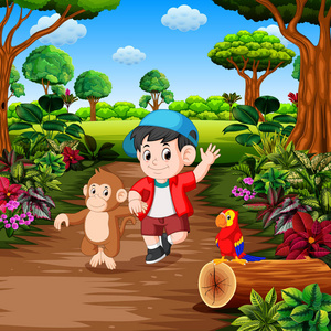 一个带着猴子在热带雨林里的男孩