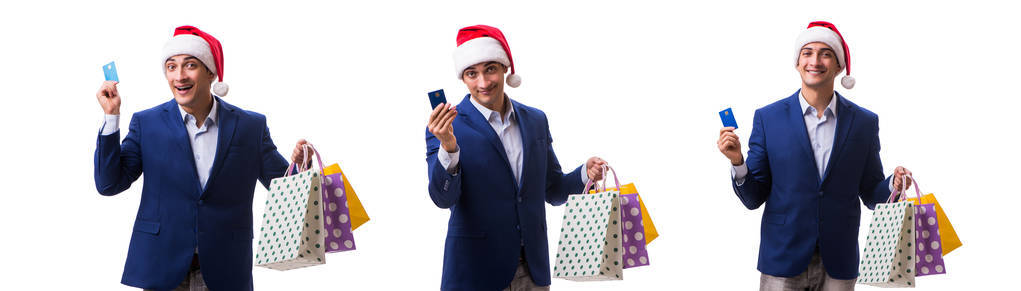 年轻人与袋子在圣诞节以后购物在白色背景