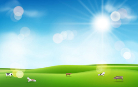 绿草与阳光和蓝天。模糊的灯光效果和奶牛为您的设计