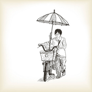 一个女孩骑自行车到市场和适应在自行车上的雨伞