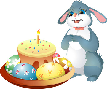 复活节兔子和复活节蛋糕与蜡烛