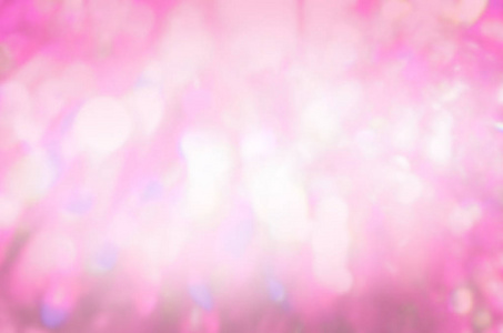 粉红色闪光复古灯背景。抽象粉红散景。模糊抽象假日背景