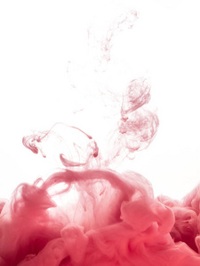 旋流油墨在白色背景上分离出的水。在水中油漆。一滴粉红色墨水在水特写的软传播。抽象背景。黄压克力泼墨的爆炸式增长