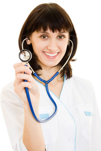 成功的女人医生用听诊器在白色背景上