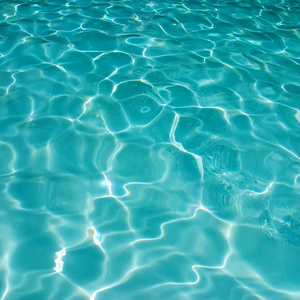 在蓝色的泳池清洁用水的波纹图案背景