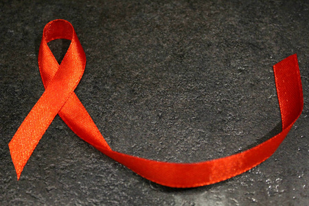 提高对艾滋病性病心脏病人健康公众支持帮助运动的红丝带意识独立的象征性颜色商标概念