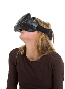 使用虚拟现实虚拟现实耳机的金发女孩