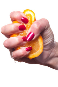 修剪整齐的指甲的手触摸白色橙色