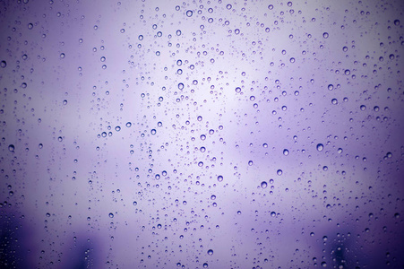 雨水落在玻璃表面背景，抽象 Backdro