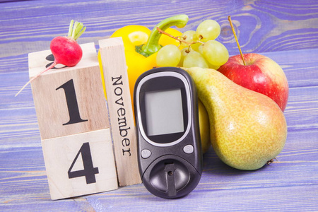 日期 11 月 14 日作为世界糖尿病日，血糖仪测量血糖水平和水果与蔬菜的象征