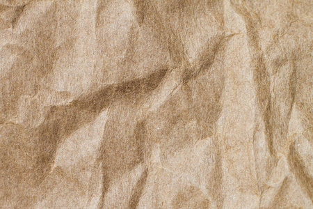 抽象的棕色回收皱巴巴的纸为背景 弄皱的