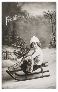 小女孩雪橇圣诞树怀旧复古图片