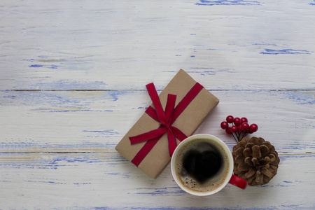 一杯咖啡, 一个肿块, 一个维伯纳姆, 一个用红色丝带绑着的礼物