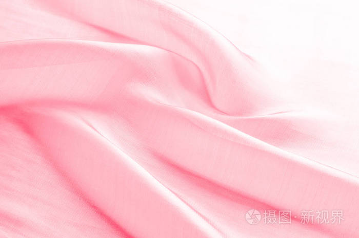 布粉色丝绸 光滑优雅的粉红色丝绸或缎子可以作为婚礼背景.