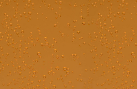 透明玻璃中钙和维生素 C 泡腾片的橙泡腾气泡的宏观拍摄